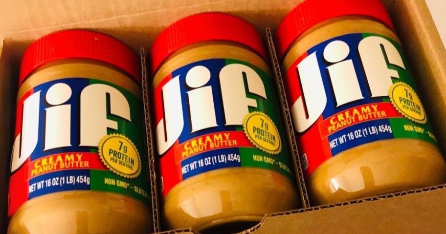3 jars of Jif Creamy Peanut Butter 16oz laying in a box