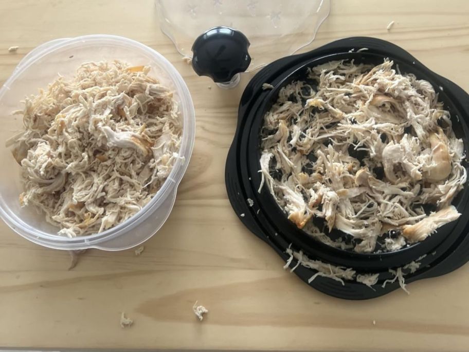 bowl of shredded chicken next to black chicken shredder with shredded chicken on it
