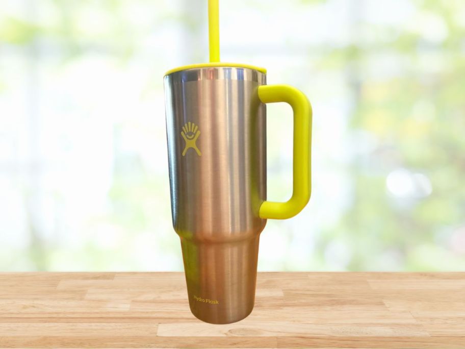 stainless steel hydro flask tumbler on wood table