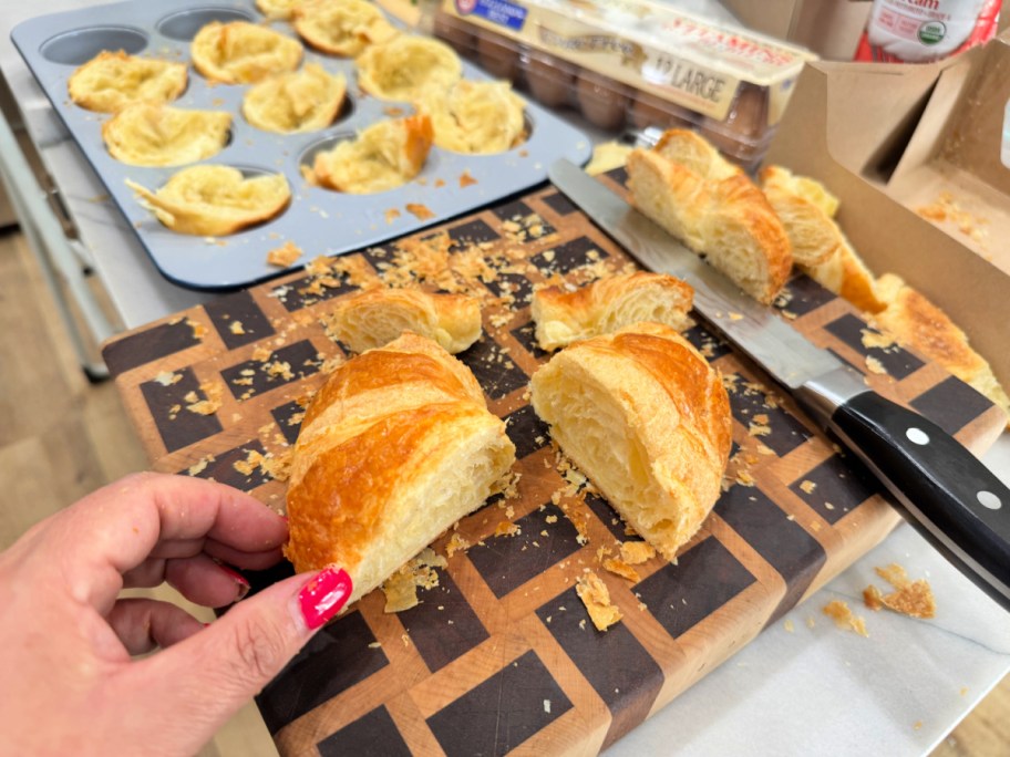 slicing a croissant in half